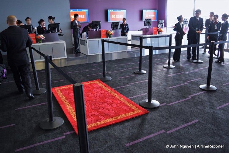 Staff prepare the check-in area for Hainan's inaugural flight from LAX to Changsha on January 21. Business class passengers have a clearly designated queue.