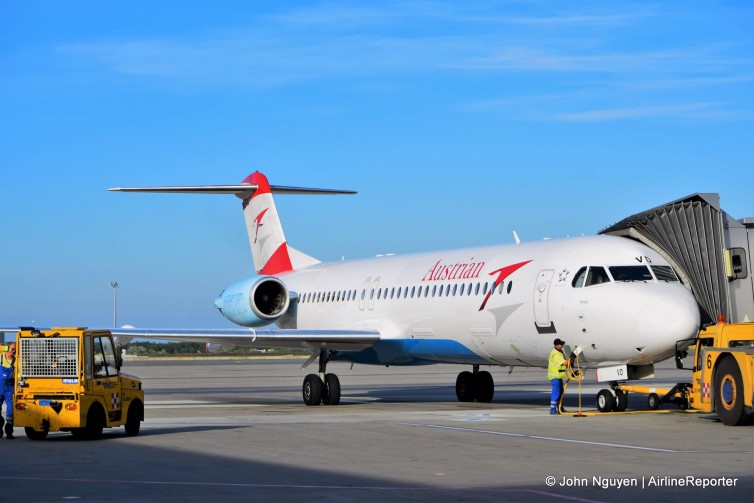 OE-LVD, an Austrian Airlines Fokker 100 parked at a jetbridge at VIE.