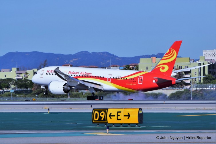 A Hainan Boeing 787-8 (B-2739), operating inaugural flight HU7923, touches down on Runway 24R at LAX.