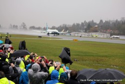 Boeing employees watch as the first MAX takes off