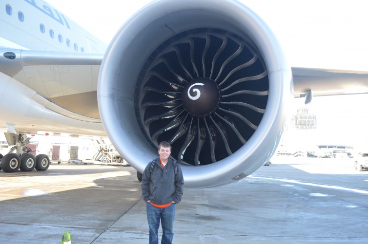 Jay standing next to the engine of Boeing 777-300ER at IAD