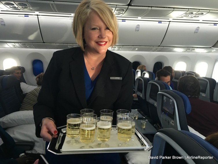 One of the flight attendants serving drinks