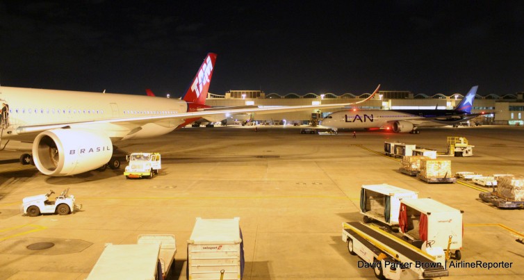 A LAN Boeing 787 Dreamliner pushes back with our TAM A350 at the gate