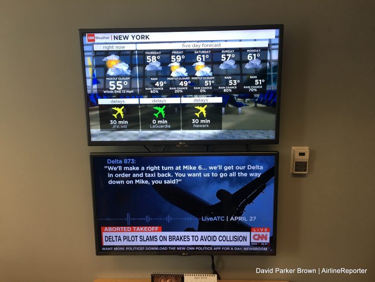 Up top shows the Airport Network, below is live CNN feed.