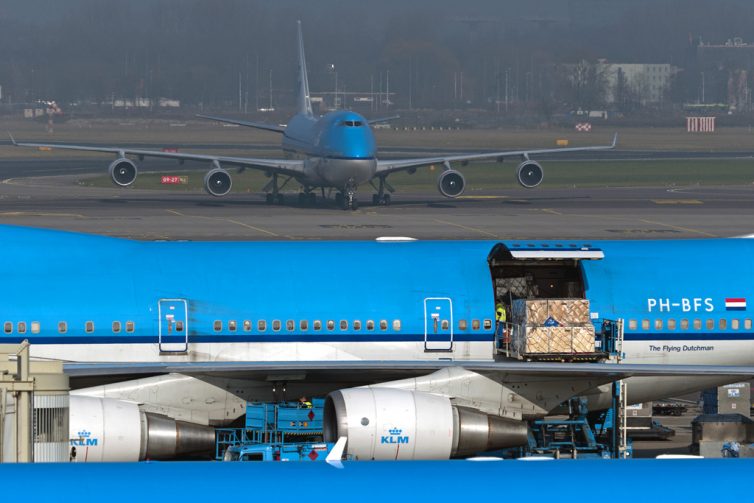 A Boeing 747-400 combi loads while another 747 taxis in the background - Photo: Pieter van Marion | FlickrCC