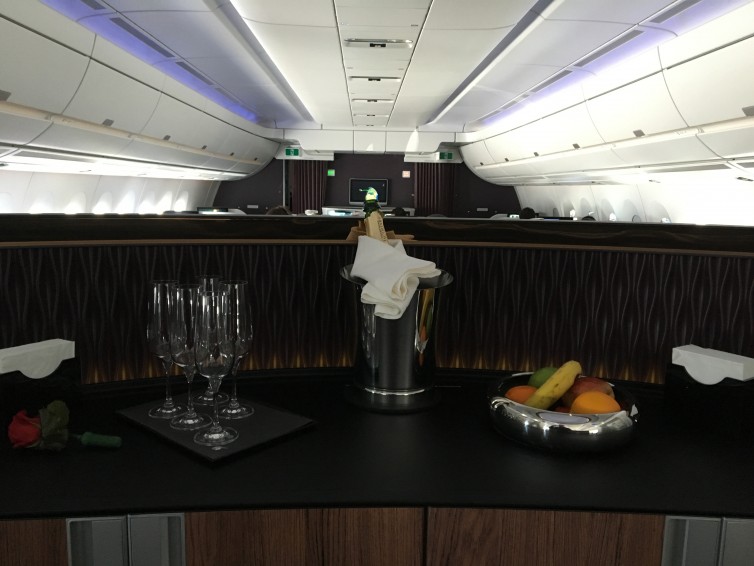 Qatar A350 business class bar, with view of forward cabin - Photo: Blaine Nickeson | AirlineReporter