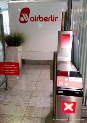 Automatic gate to the "exclusive" waiting area for Air Berlin and Etihad Partners elites. Red X means "No Entry."