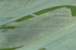 A piece of old of the old six runways blends into airfield surface - Photo: Alastair Long | AirllineReporter