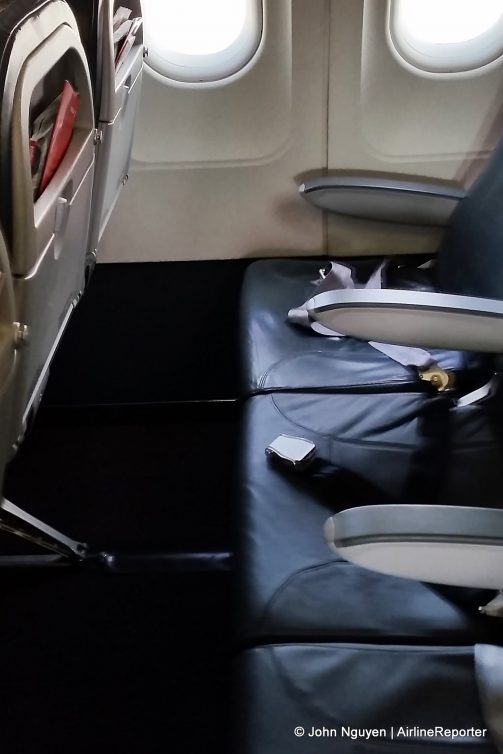 Convertible business class seats on an Iberia Airbus A320. Note the lack of a fixed, removable center console.