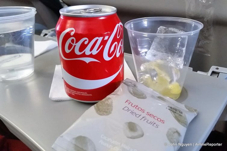 Beverage and snack, courtesy of a friendly Iberia flight attendant on a buy-on-board flight.