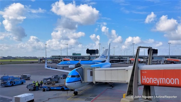 KLM 737-800 (PH-BXT) at Amsterdam Airport Schiphol, ready to take us to Prague, with a 737-700 (PH-BGW) taxiing behind