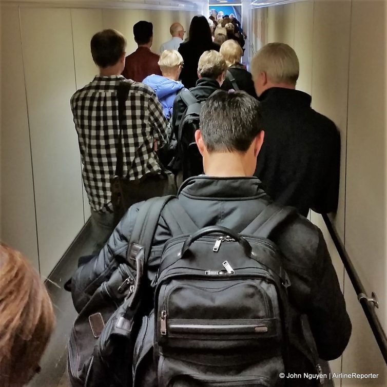 Passengers at Amsterdam Schiphol. boarding a KLM flight to Prague