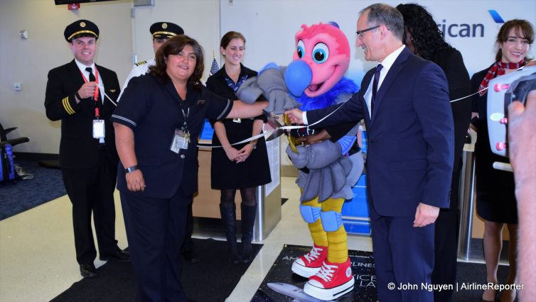 Chuck helps an American Airlines employee with the ribbon cutting.