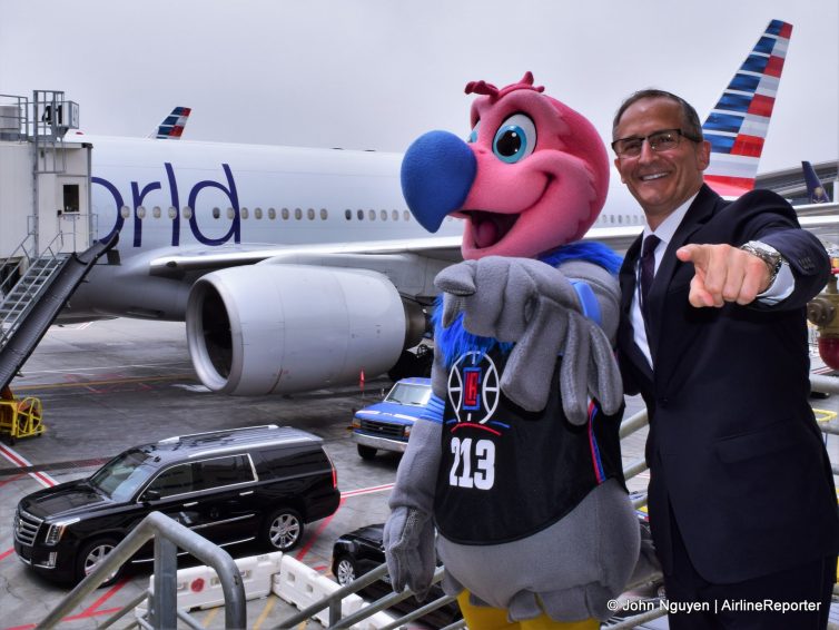 Chuck the Condor, the LA Clippers' mascot, and Jim Moses, AA's Managing Director at LAX, pose in front of N791AN, a 777-300ER in Oneworld livery.