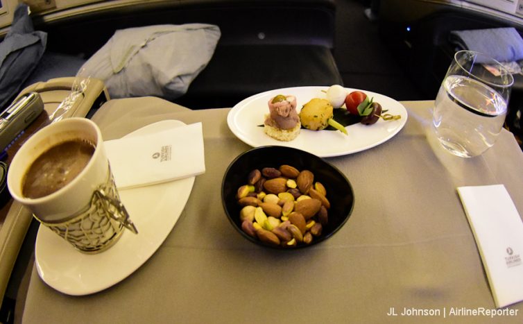 Warm nuts, traditional Turkish coffee, a Turkish delight and an appetizer.