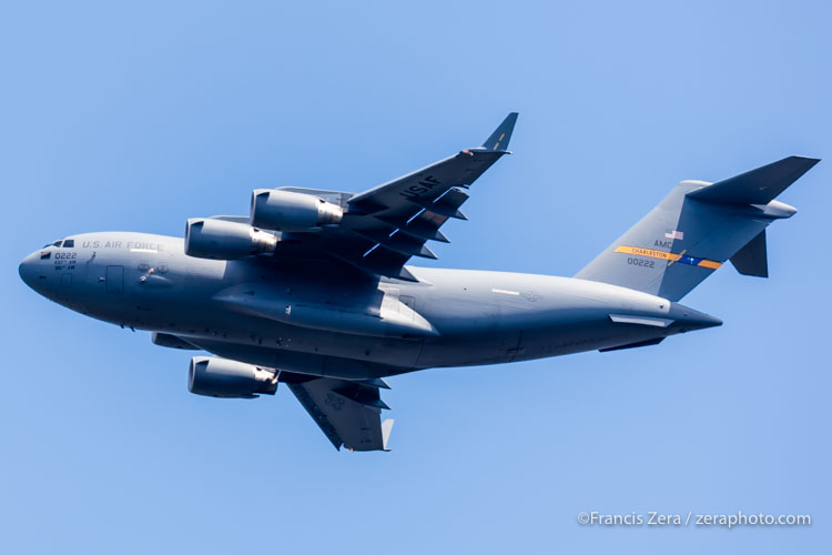 Two C-17 cargo jets first ferry in the presidential motorcade a day or so in advance of the visit. Advance teams scout travel routes and hotels, roads are closed with little warning once the final plans have been made. This one is outbound from SEA following AF1's departure