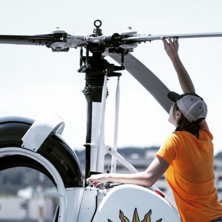 Kassy performing a pre-flight on an S300 helicopter - Photo: Sean Fujiwara