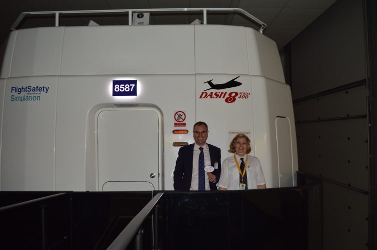 Stood outside the Dash 8 sim with Program Manager, Michele Rodrigues - Photo: Cristina Rodriguez | FlightSafety