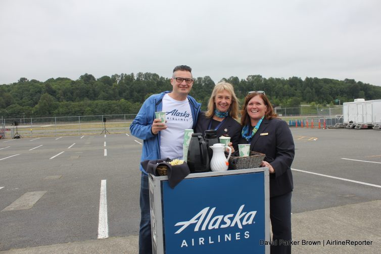 Friendly Alaska flight attendants serving coffee.