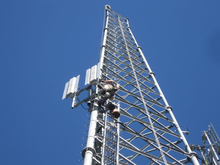 A worker climbs a Gogo cell tower, one of over 250 across North America.