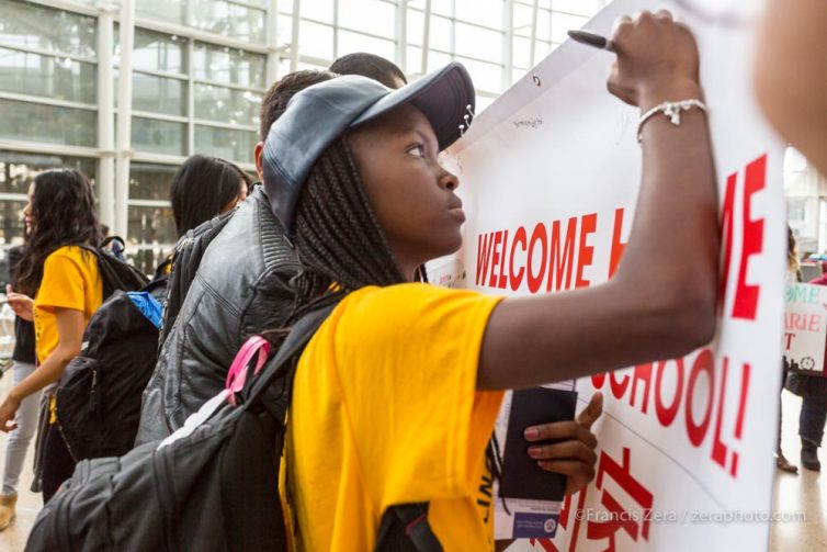 The airline held a welcome-home ceremony for the students, who all signed a commemorative poster