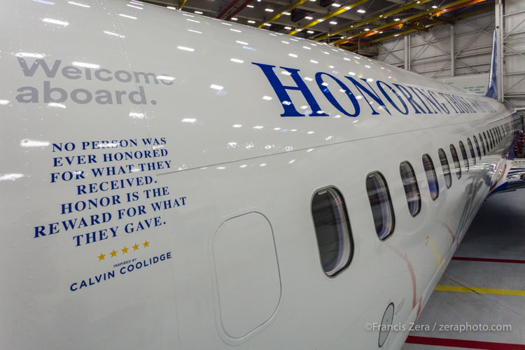A quote from President Calvin Coolidge is printed near the forward boarding door: "No person was ever honored for what they received. Honor has been the reward for what they gave."