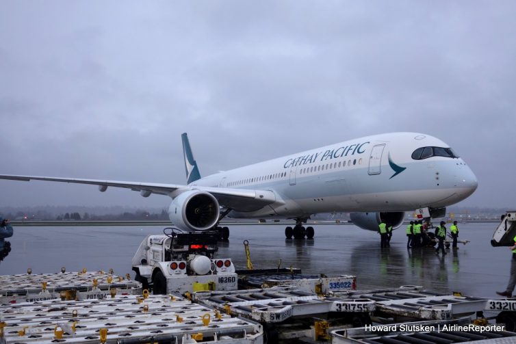 Cathay Pacific's first A350 from HKG to YVR is ready for a tug to pull it to the gate