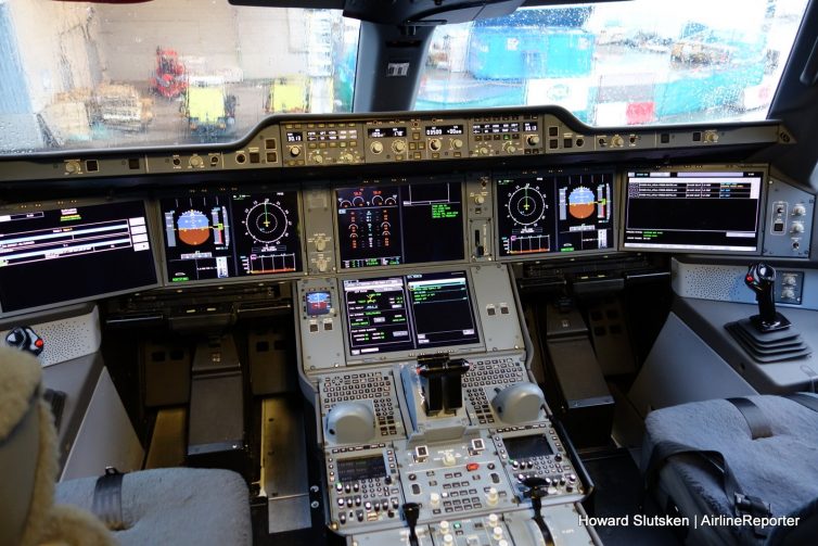 The advanced flight deck of Cathay Pacific's A350, B-RLI, at the gate at YVR