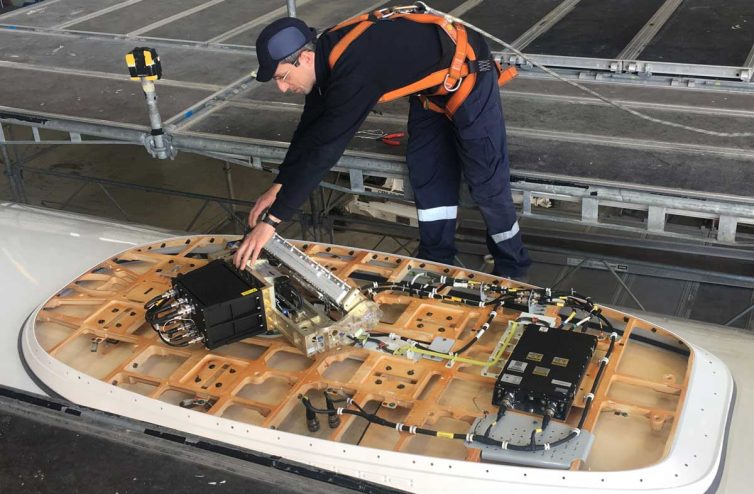 A Technik Worker Shows off Lufthansa's New In-Flight Connectivity Tech. - Photo: JL Johnson | AirlineReporter