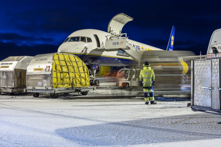 Palletized freight is loaded aboard an Icelandair Cargo 757-200F at Keflavik International Airport.