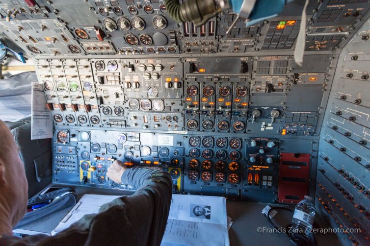 The flight engineer's station contains a remarkable number of gauges and controls.