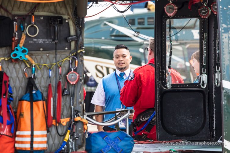 An attendee looks into King County's rescue helicopter at the event.