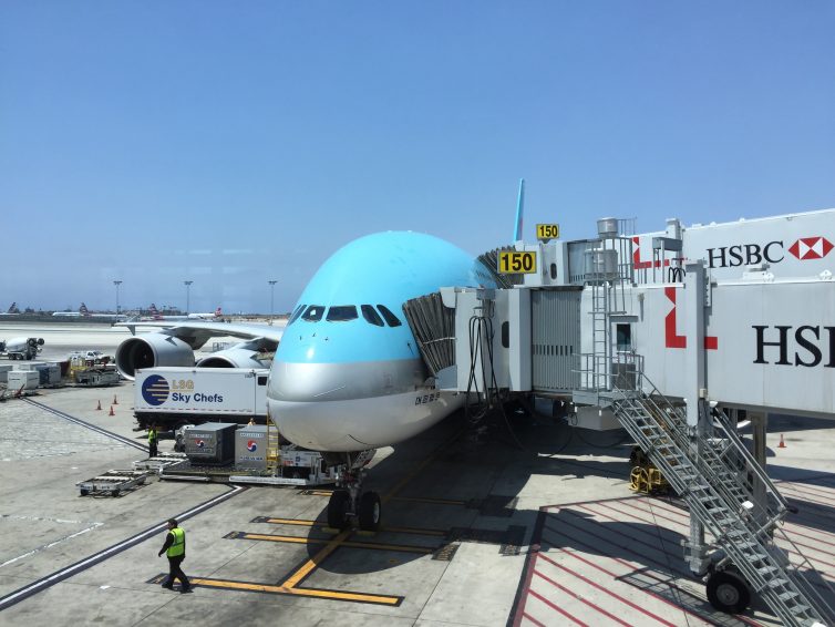 A380 and its three jetways. Prestige boards via the upper jetway. - Photo: Kevin P Horn
