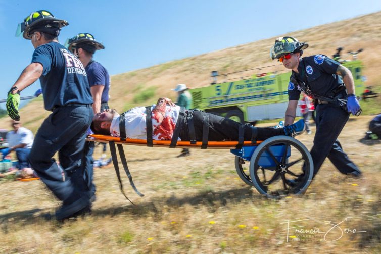 Firefighters from the Port of Seattle remove a simulated casualty during the airport's recent triennial disaster drill.