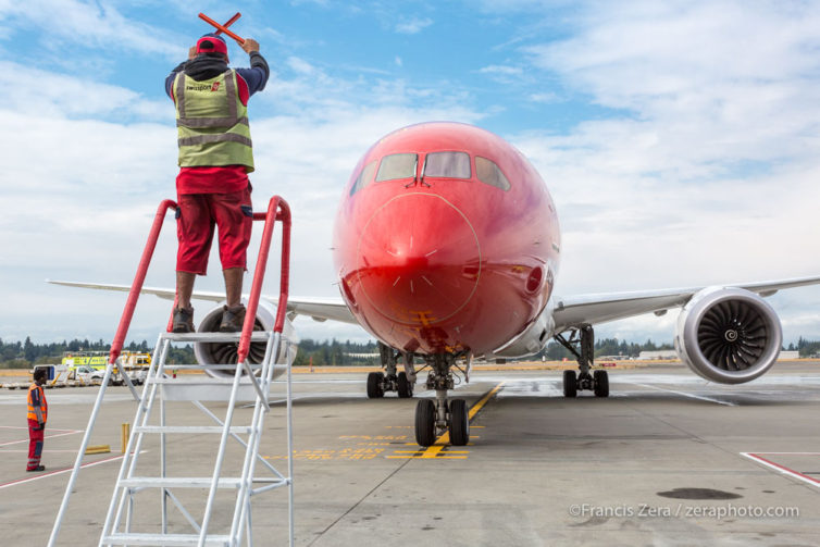 Norwegian's inaugural flight to Seattle from London Gatwick, a Boeing 789, rolls up to the parking stand.