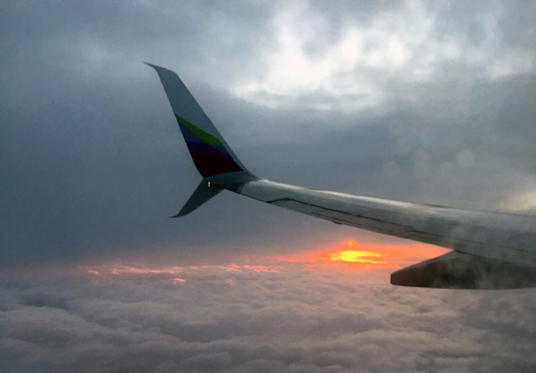 Flying into the sunrise on Alaska - Photo: Brittany Rolfe | The Girlfriend