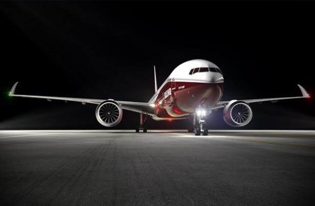 The 777x's wingtips will fold after landing to allow the aircraft to use standard airport gates. -Boeing image