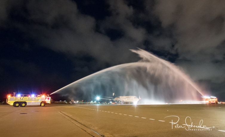 The inaugural flight from Mexico City arrives in Seattle to a traditional water-turret salute.