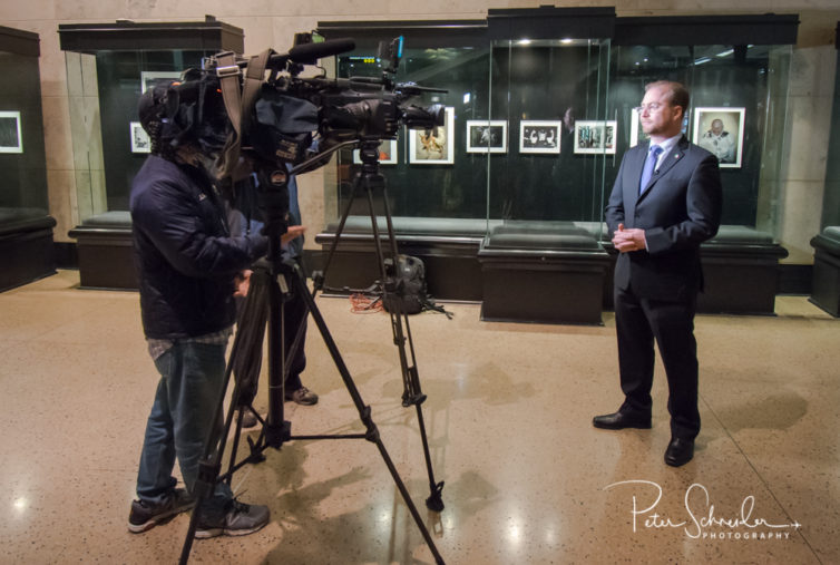 Roberto Dondisch, Mexico’s Consul General in Seattle, is interviewed by local media inside the terminal.