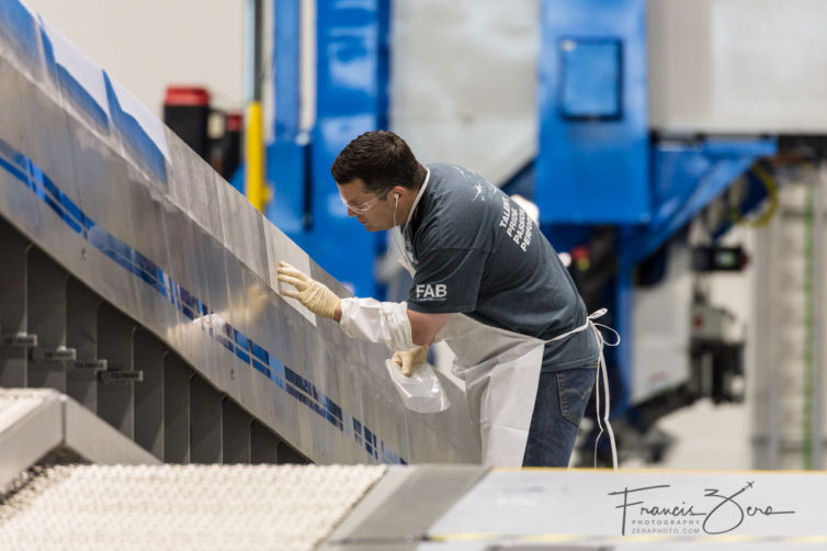 A Boeing employee inspects a composite wing spar at the Building 40-02 spar shop.