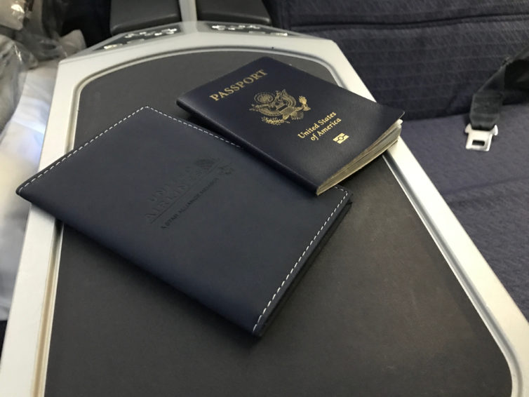 No, I'm not showing you the inside of my passport. But the stamp is in there. United also handed out passport covers to commemorate the flight.