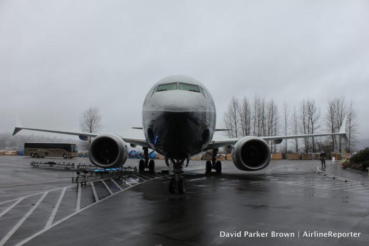 The aircraft almost blends into the gray Seattle skies.