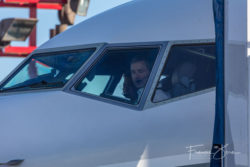 Flight crew prepare the plane for takeoff.