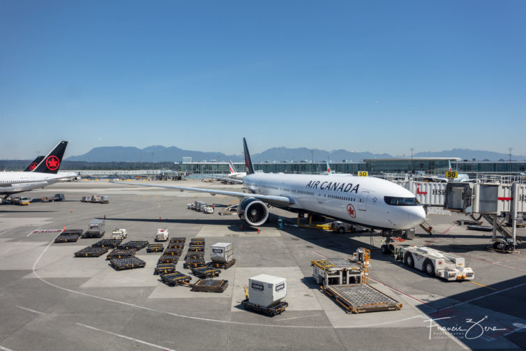An Air Canada 777-300ER being prepared for a transcontinental flight from Vancouver to Toronto.