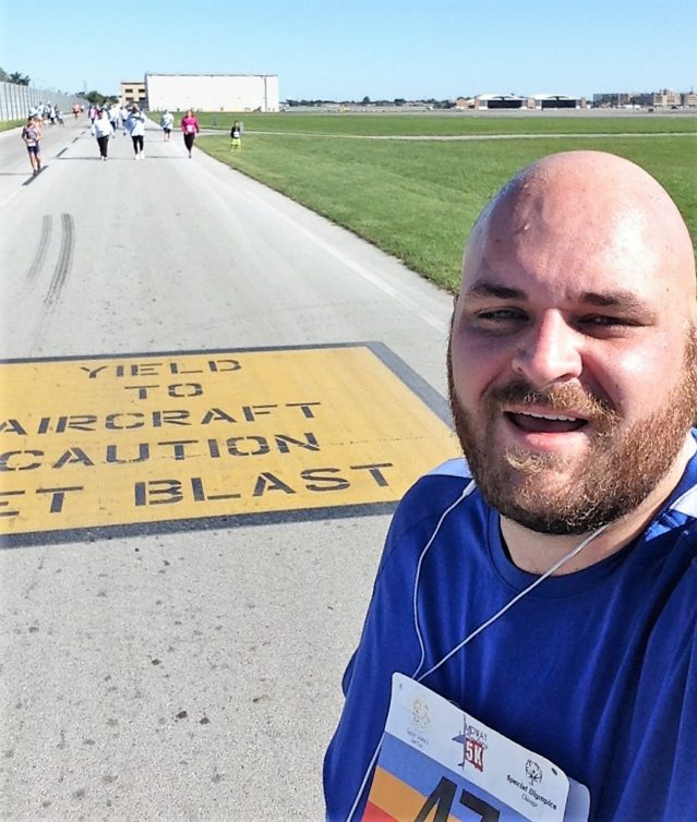 JL pauses for a brief moment to take a selfie to commmerate his first 5K. Yes, he ran the whole thing.