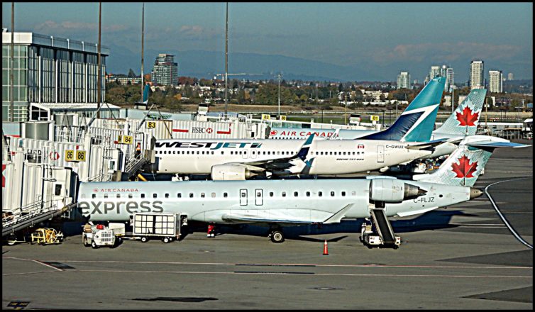 A collection of aircraft lined up for departure at YVR.