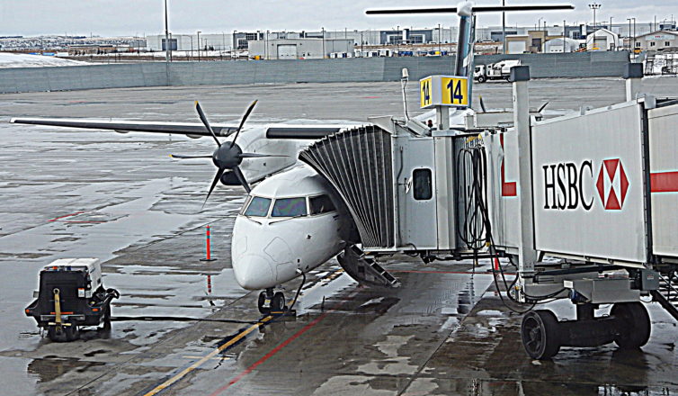 WestJet Q400 parked at YYC - Photo: John Jamieson