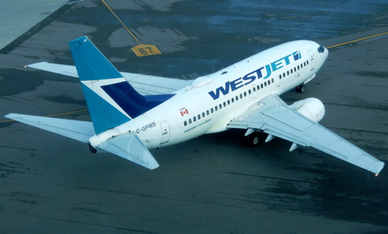 WestJet 737-600 pushing back at YVR