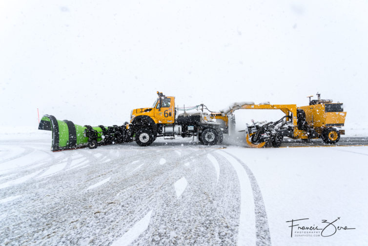One of Sea-Tac's nine plow-and-broom trucks cleans a runway intersection.