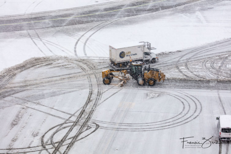 All manner of vehicles are pressed into service to keep the ramps and taxiways clear.